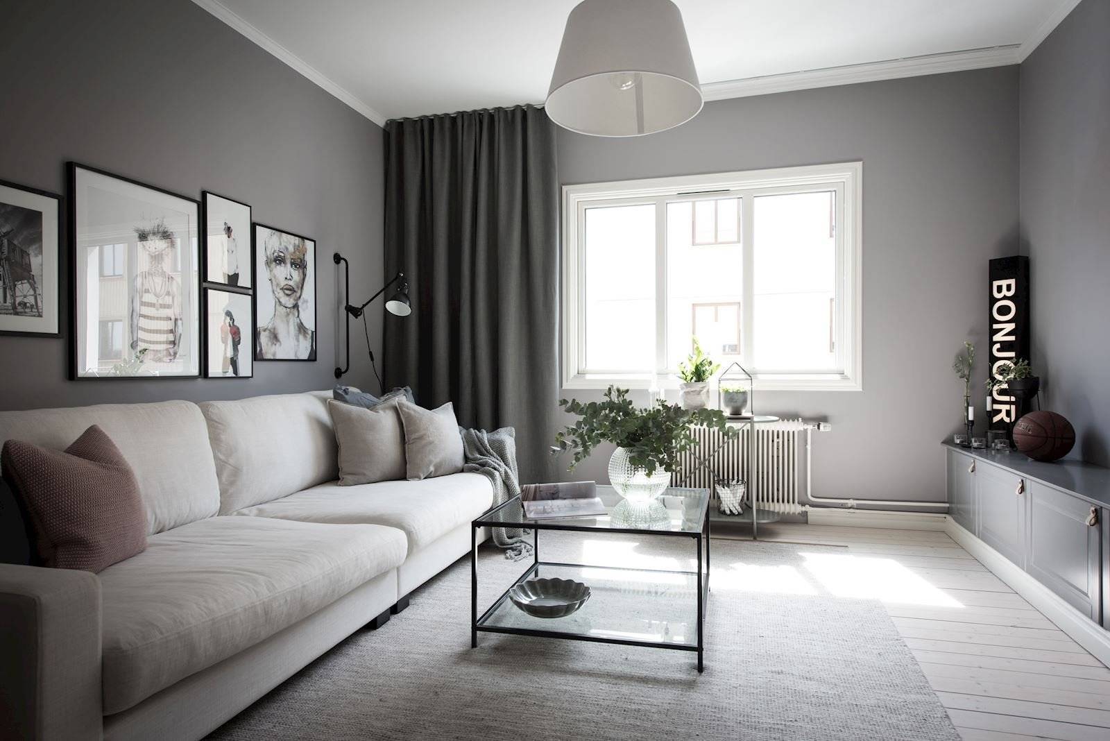 Черно-белая гостиная: отделка, стенка и другие элементы в интерьере